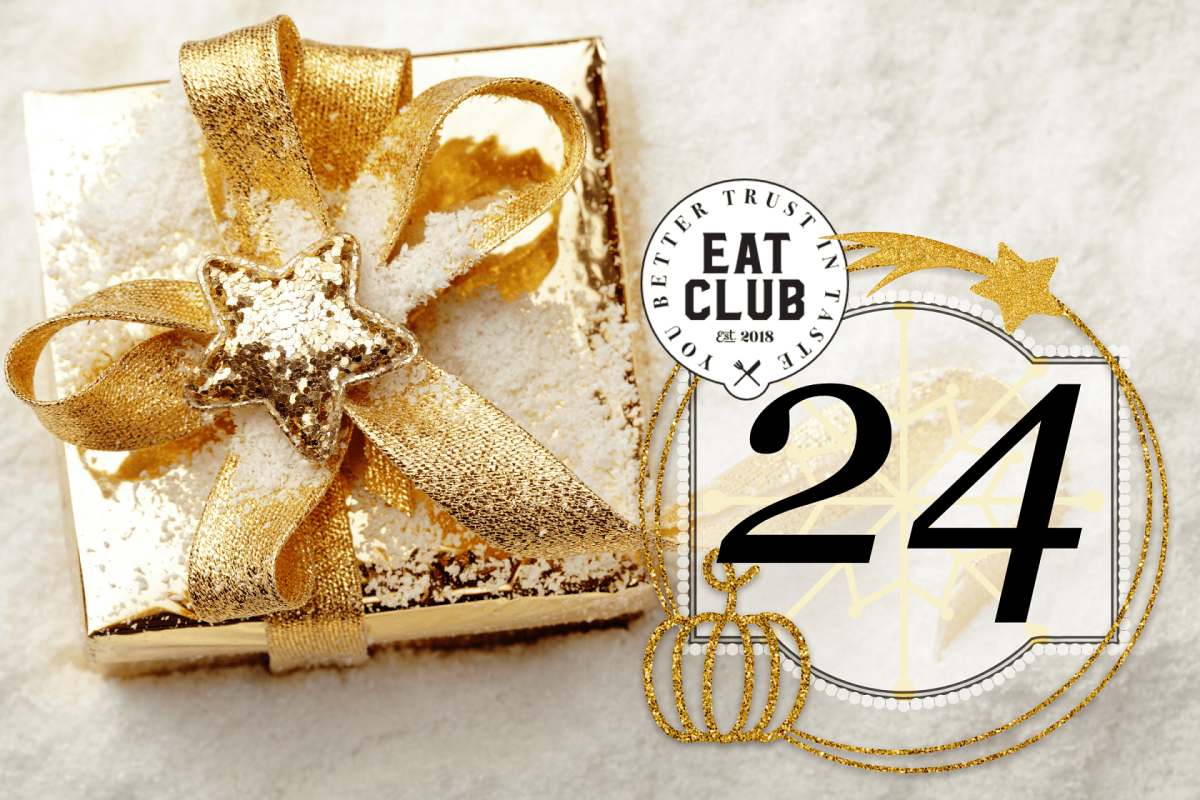 Ein gold eingepacktes Geschenkt auf hellem Untergrund, mit Symbolbild und EAT CLUB Logo.